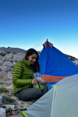 Roya digs in to a bowl of Cous Cous sierra nevada mountains wilderness dinner camping backpacking