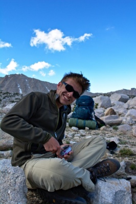 John enthusiastically opens a can of tuna sierra nevada mountains wilderness dinner backpacking camping