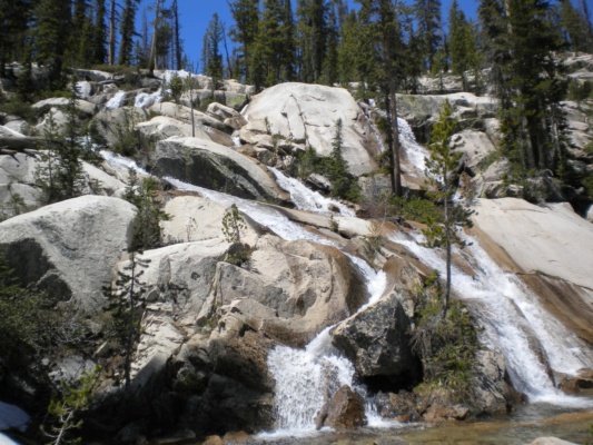 The melting snow feeds a multitude of streams that flow down the mountainside. sawtooth mountains wilderness cascade