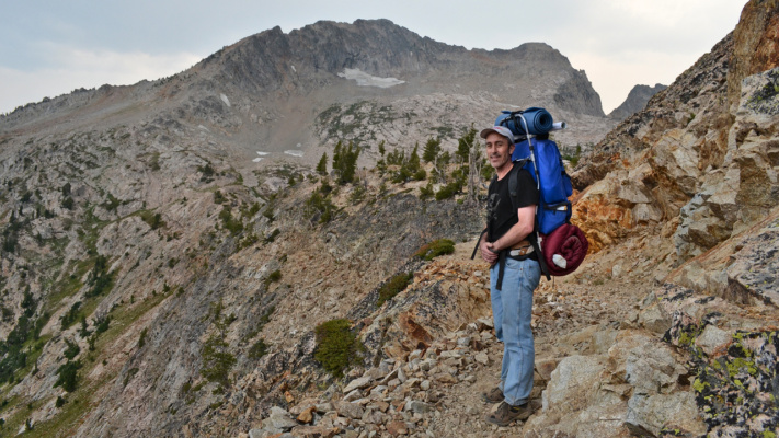 We made it to the top of the pass! All downhill from here. backpacking sawtooth mountain wilderness