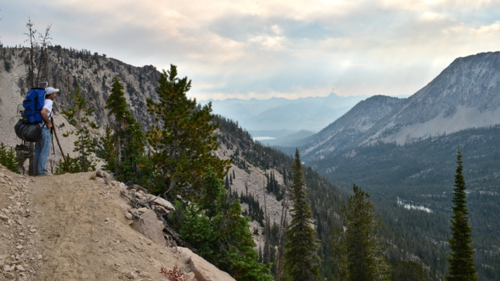 Dad looks out over the landscape before we turn to crest another pass landscape vista backpacking sawtooth mountain wilderness
