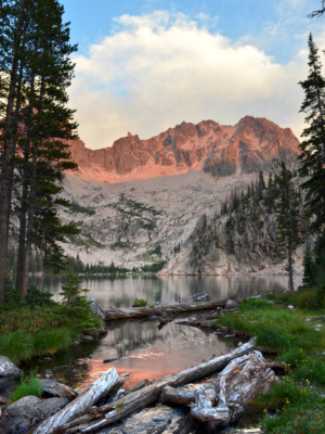 The last light of day illuminates the peaks above Upper Cramer Lake alpenglow sawtooth mountain wilderness