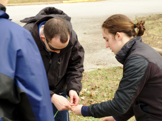 Cedar shows Grant how to tie a knot knot tieing