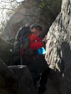 Sharon celebrates after traversing a tricky section rock scramble old rag shenandoah national park