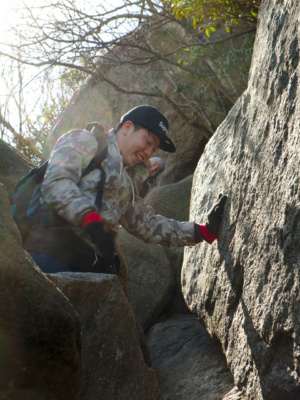 Sean laughs after conquering a tricky bit of climbing rock scramble old rag shenandoah national park