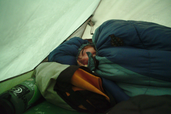 The only real way to get and stay warm is to bury oneself in a sleeping bag tent camping