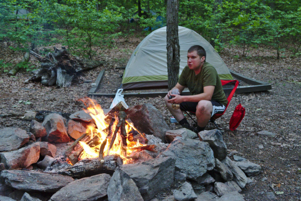 Josh tunes in for the early morning special, "Crackling Flames." campfire camping