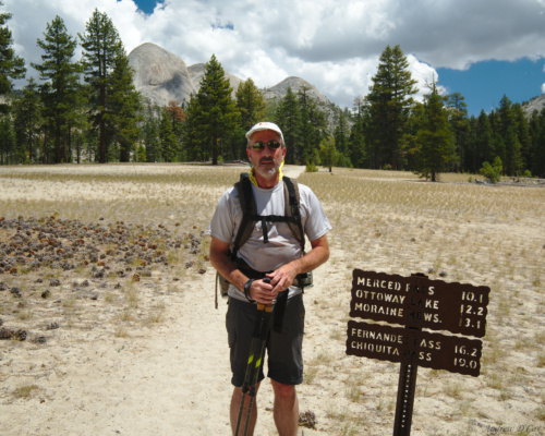Dad, looking cool in this desert landscape. Note the sign: less than 10 miles left! desert dad sunglasses
