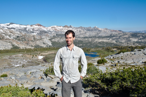 Yours truly poses for a photo on top of Isberg Pass with Yosemite National Park in the background isberg pass yosemite view