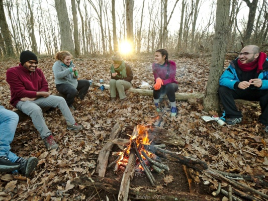 We're all cheerful as we relax around the campfire. campfire backpacking sunset