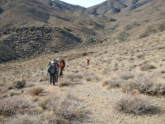 Marika, Peter, and Brian climb a short hill to another saddle. death valley wilderness