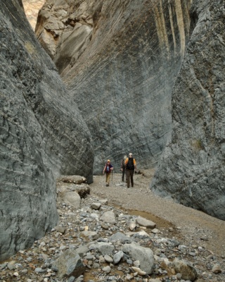 While walking through the slot canyon, I imagine the raging flash floods that must rush between these walls. death valley marble canyon middle narrows