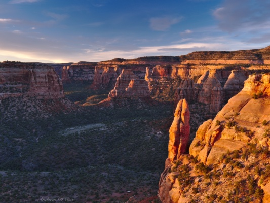 Early morning light illuminates the spires in Monument Valley colorado national monument sunrise