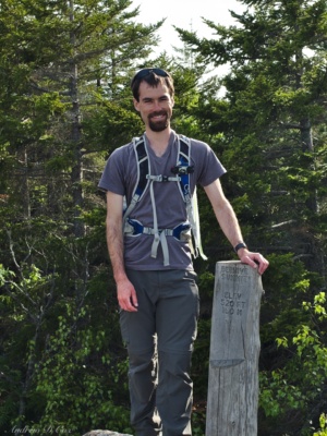Yours truly with the summit sign; photo credit: Kenza acadia beehive summit