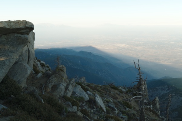 The shadow of the mountain stretches far across the valley below cucamonga peak mountain shadow