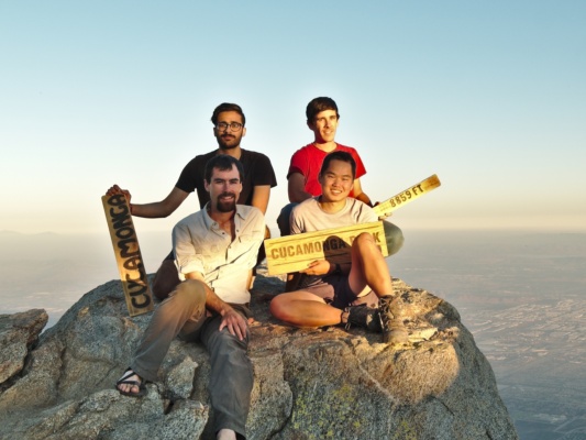 Nihal, Coco, myself, and David on the summit with several of the signs cucamonga summit