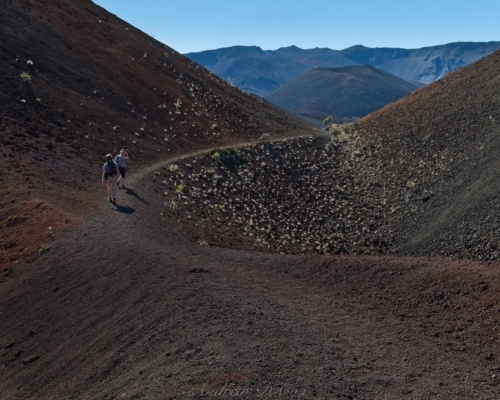 The trail winds between the cinder cones haleakala hiking trail cinder cone