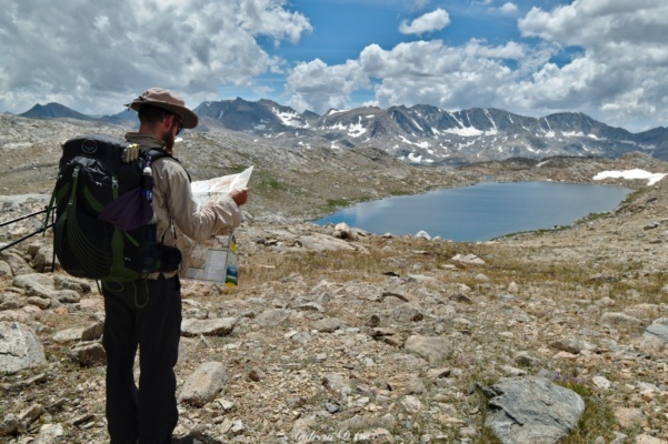 Daniel checks the map to determine our location humphreys basin navigation