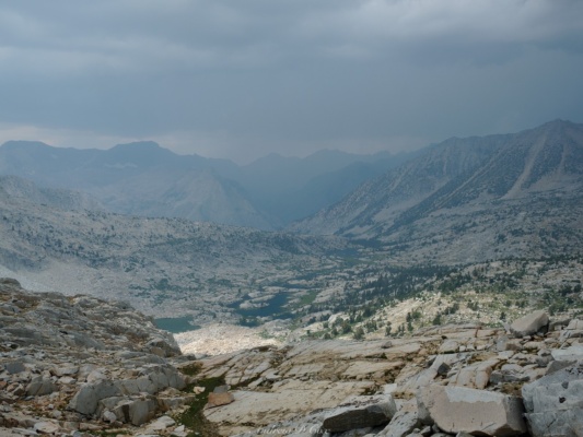 Rain falling on the distant Muir Pass makes for a dark, foreboding view, though I remain nice and dry sierra high route storm