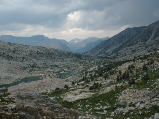 The rainstorm clears while I sit at Knapsack Pass and eat my lunch; a fine view of Dusy Basin opens up below sierra high route dusy basin