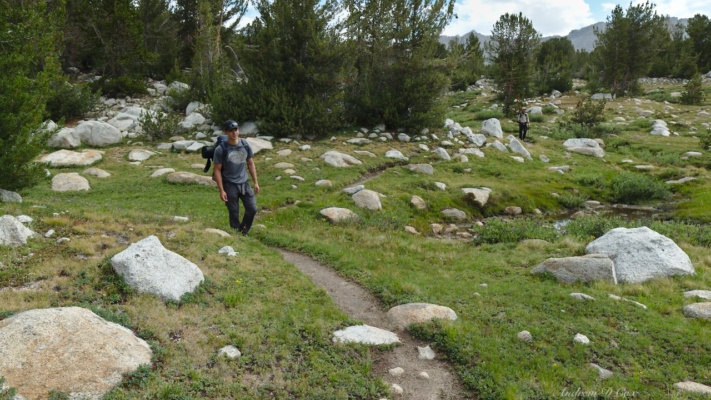 Josh and Daniel wind their way through the lush meadows in French Canyon french canyon trail