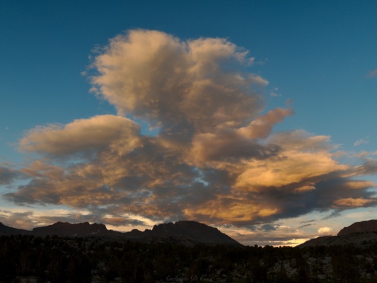 The evening light colors the clouds as well humphreys basin sunset