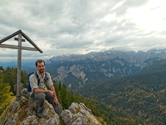 Robert takes a photo of yours truly with the summit marker alps kruezeck summit