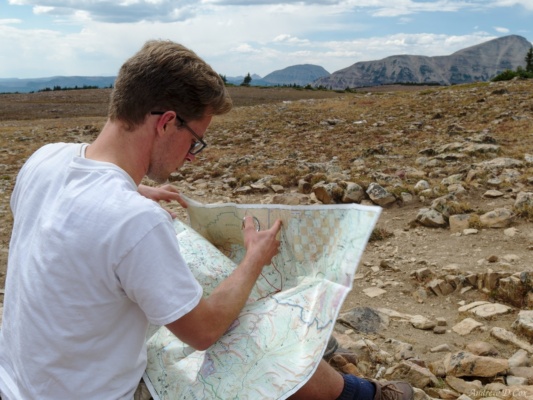 Brian checks our location on the map at Rocky Sea Pass uinta mountains rocky sea pass