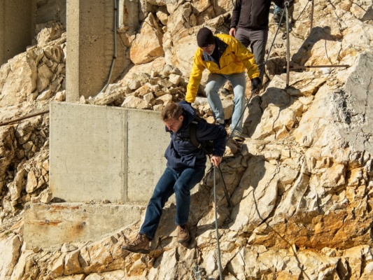 Robert and Steve navigate their way along the via ferrata alps via ferrata
