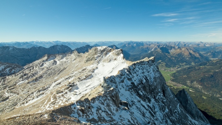 The Austian Alps span the entire horizon... Closer to Zugspitze, the Northern Schneeferner glacier sparkles in the morning sunlight alps south austria