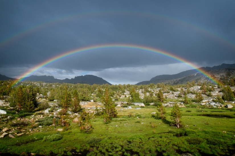 After being thoroughly soaked and chilled by an afternoon thunderstorm in the Sierra Nevada Mountains, the sun peaked out from the angry clouds to create this wonder! sierra nevada storm supernumerary rainbow