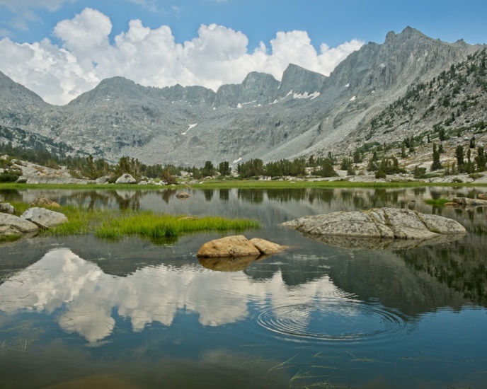 The nearby mountains partially obscure the towering cumulonimbus clouds now congregating over the Palisade Basin; meanwhile, Dusy Basin is peaceful and beautiful! Knapsack Pass is the large saddle on the left side of the frame. sierra nevada dusy basin