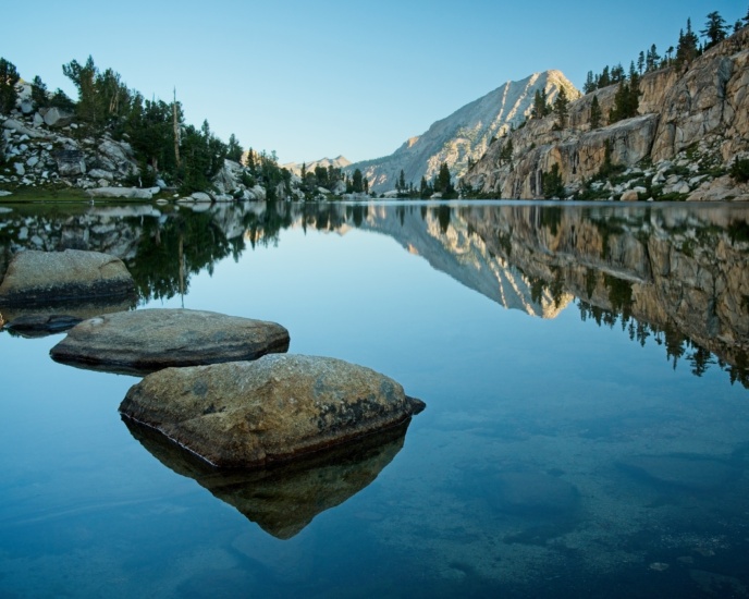 The early morning light illuminates the peaks but leaves Izaak Walton Lake in shadow sierra nevada izaak walton lake