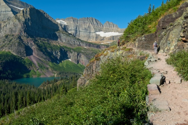 The trail ascends above Grinnell Lake glacier national park grinnell trail