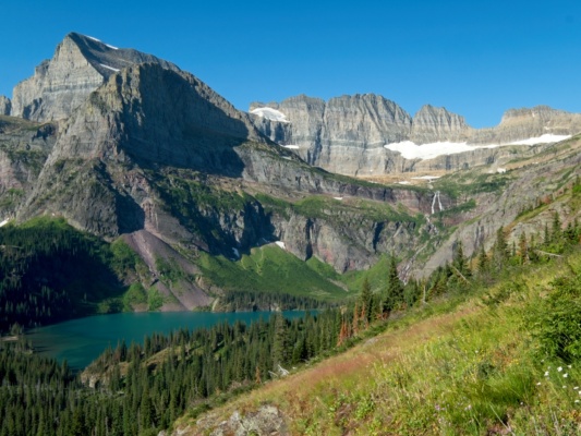 Looking up toward the Salamander Glacier: massive cascades, cliffs, and a beautiful lake. glacier national park cascades