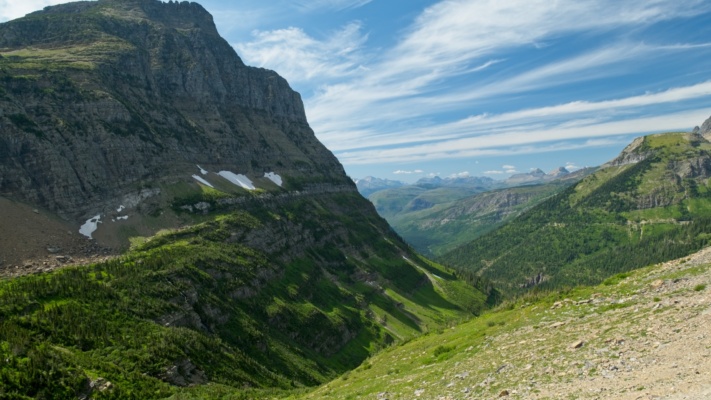 A view down the Logan Creek drainage on a sunny afternoon glacier national park