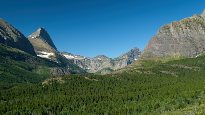 A view of the mountains surrounding the Ptarmigan Trail glacier national park ptarmigan trail