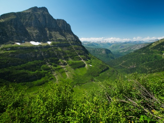 As we walk along the trail, we get different perspectives of the cliffs across the valley glacier national park highline trail