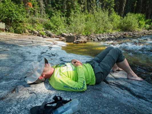 After a hot afternoon hike it's nice to relax in the cool shade beside the river glacier national park