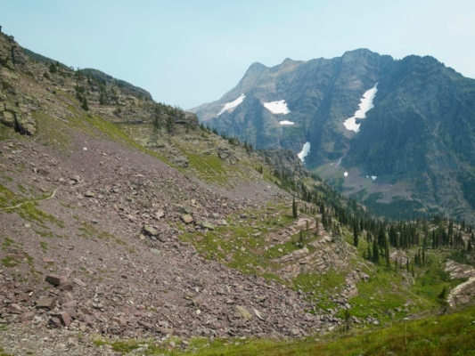 The shadeless, barren landscape makes for a toasty afternoon walk glacier national park trail