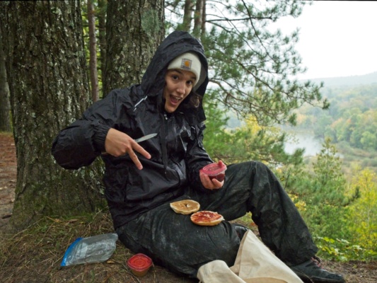 Kenza enjoys a PB&J bagel camping