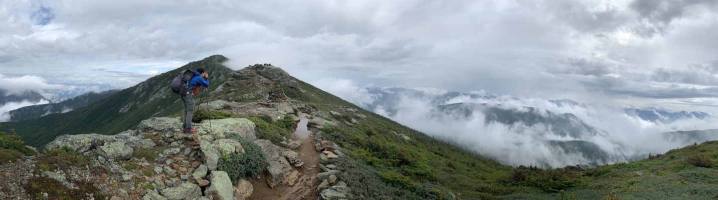 I pause to take a picture of the clouds swirling around Franconia Ridge. Photo credit: Diane pemi loop franconia ridge