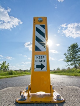 Barriers on the paved trails prevent cars from mistaking them for roads