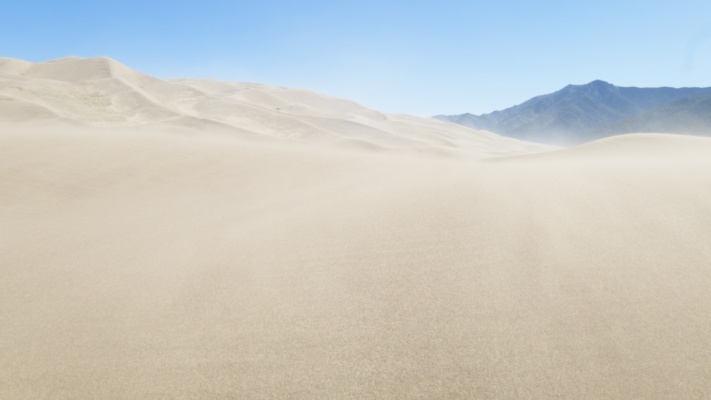 Another view of sand blowing over the dunes