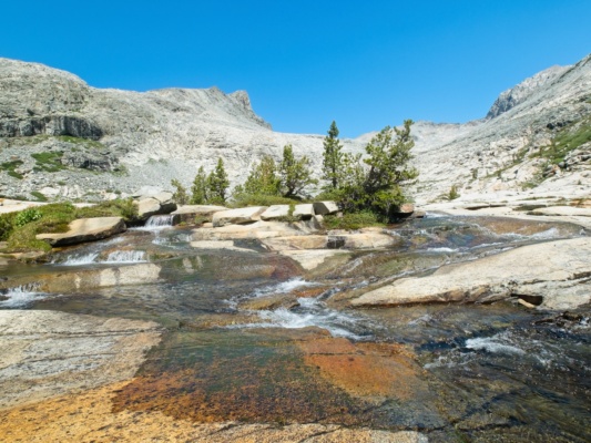A common sight in the Sierra - water rushing down large stone slabs sierra high route bench canyon