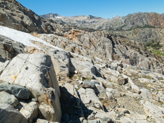 It takes me a while to navigate across the ridge since the rock is smooth and I have to find safe paths around steep chutes sierra high route cross country