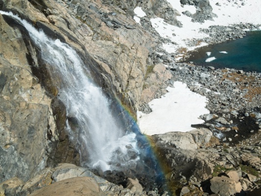 I move carefully to the edge of the cliff to get a photo of the waterfall sierra high route waterfall