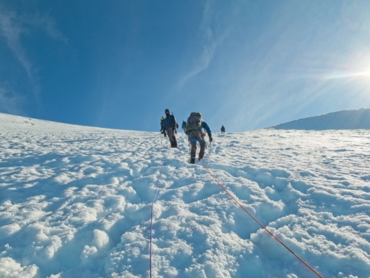 There are plenty of rope teams coming up the glacier as we descend; we pause and let them pass mount baker easton glacier