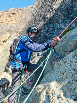 Matt Y. comes out of the clove hitch at the anchor to begin climbing beckey route liberty bell