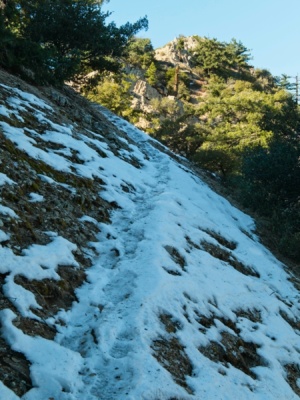 The north-facing slopes are still covered in snow brown mountain hiking